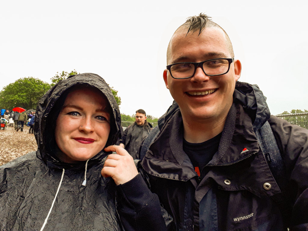 Esther and Rob smiling in the rain