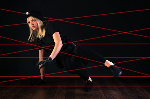a person trying to manoeuvre a bunch of laser beams