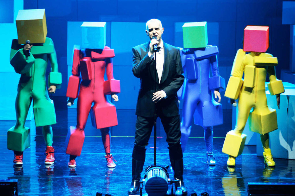 Pet Shop Boys performing on stage with backing dancers