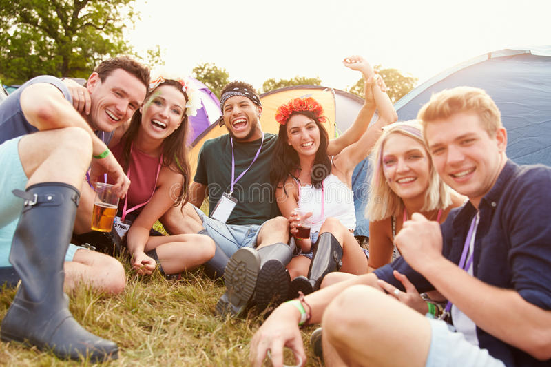 group of friends at a festival having fun and smiling